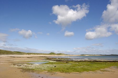 Wide Panorama of the beach at Dunstanburgh, Northumberland, Englandの写真素材