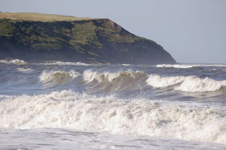 Big rolling waves coming into the north bat at Scarborough, Yorkshireの写真素材