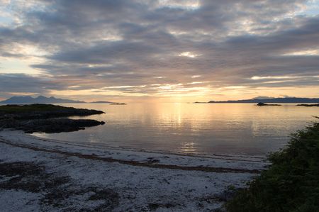 Sunsetting over the sea at Arisaig Scotland at the beach where Local Hero was filmedの写真素材
