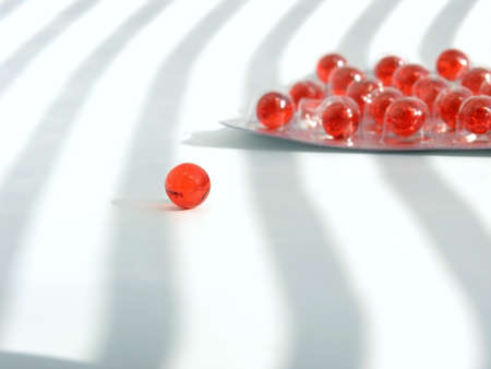 red pills on white backgroundの写真素材