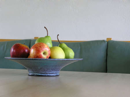 fresh fruits on blue plate (living room)の写真素材