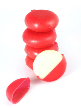 yellow mini cheese isolated on white backgroundの写真素材