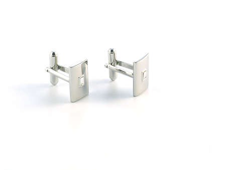 silver cuff link isolated on white background
