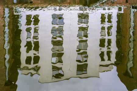 House facade reflection in the waterの写真素材