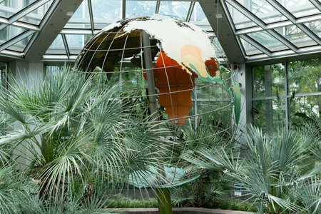 A large globe in the tropicarium. Palm house, botanical garden. Frankfurt am Mainの写真素材