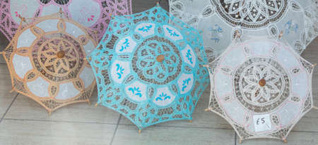Colorful umbrellas on display at a store. Paphos, Cyprus. Openwork sunshade from the sun.の写真素材