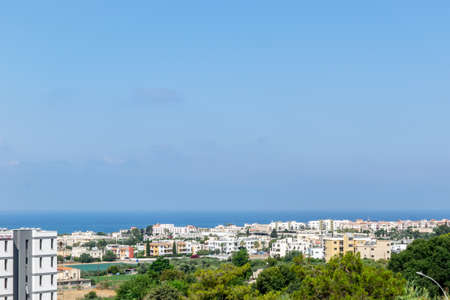 View of the city and the sea. Paphos, Cyprus. Green in the city and clear blue sea.の写真素材