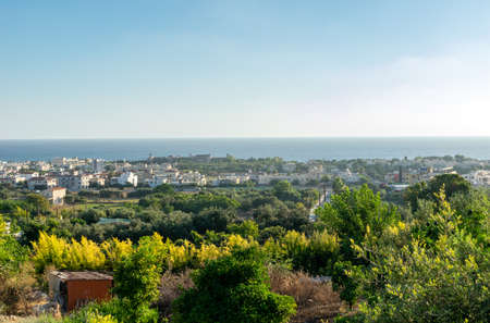 Cyprus landscape. View of the city. Limestone buildings by the sea. Sea and mountains.の写真素材