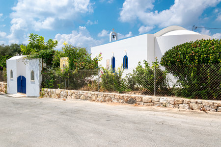 White chapel of Protaras village. Blue roof and windows. The belfry at the top. Akamas Peninsula, Cyprus.の写真素材