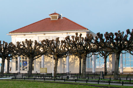 Entrance to the pier. Trees and a glazed terrace overlooking the sea.の写真素材