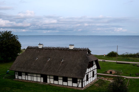 A view of an old house on the shores of the Baltic Sea.の写真素材
