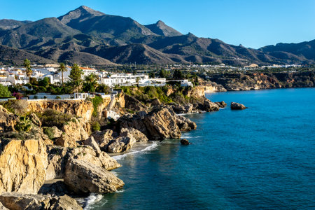 Title: View of the beautiful city of Nerja. Andalusia, Spain. Panorama of the sea, city and mountains.の写真素材
