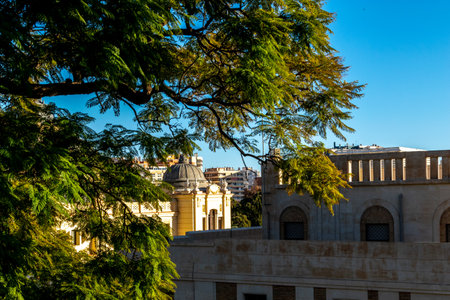 View of the cathedral in Malaga on a beautiful summer day. Photo against the background of trees.の写真素材