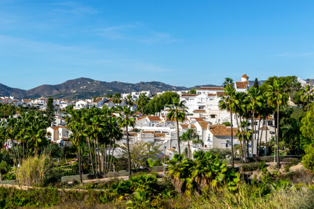 White architecture in the city of Nerja, Spain. Panorama of the city and mountains.の写真素材