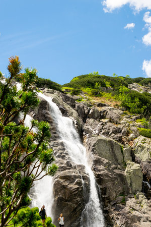 Mountain landscape with waterfall in Tatra Mountains, Poland. The largest waterfall in Poland, Wielka Siklawa. The world of beauty.の写真素材