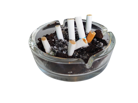 Cigarette in the ashtray isolated on white background side viewの写真素材