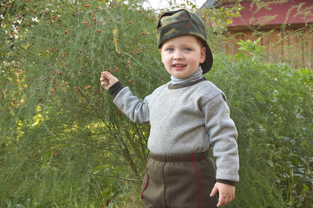 Small boy holding the asparagusの写真素材
