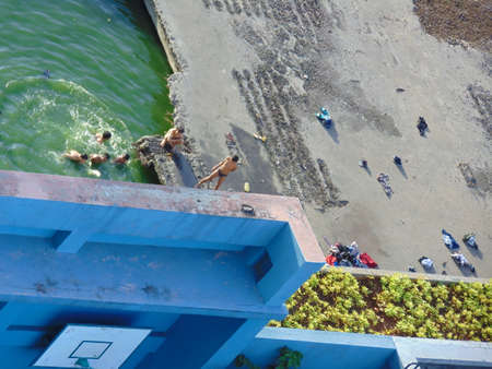 Asian kids playing in the artificial lake