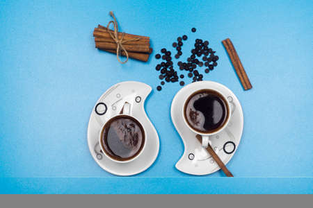 Coffee cup and beans on old kitchen table. Top view with copyspace for your textの写真素材