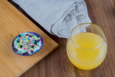 Tasty cupcakes on a wooden table.の写真素材
