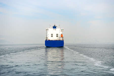 the blue container ship cruising at seaの写真素材