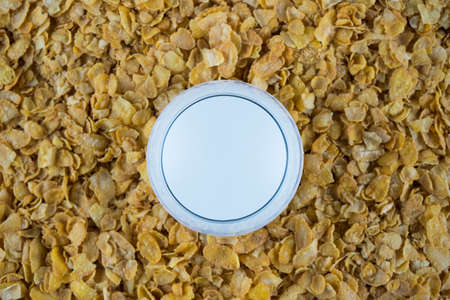 Breakfast in a glass of milk over muesliの写真素材