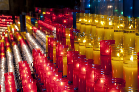 Church red yellow and white votive candles Montjuic Barcelonaの写真素材