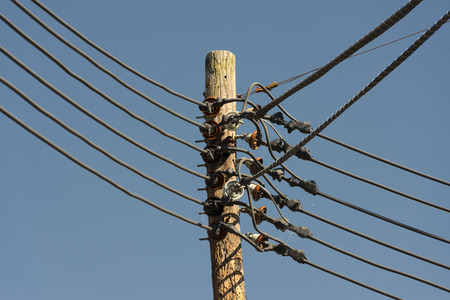 Power line cables on the blue sky backgroundの写真素材
