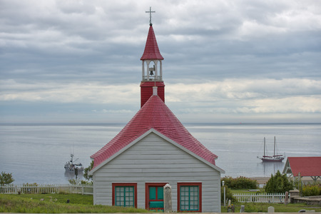 tadoussac old wood red tower churchの写真素材