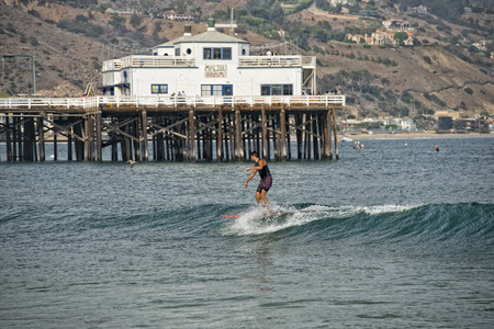 Malibu Pier with surfers and pelicans