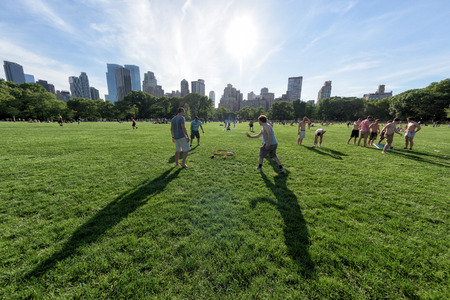 NEW YORK - USA - 14 JUNE 2015 people is spending time amusing in central park on sunny sundayのeditorial素材