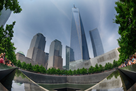NEW YORK - USA - 13 JUNE 2015 people near freedom tower and 9/11 memorial at ground zero