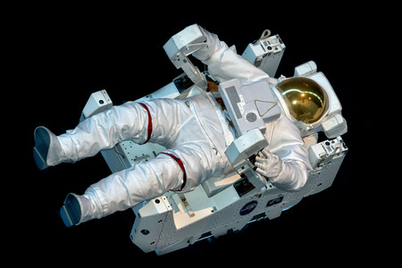 Astronaut Space Suit isolated while floating on black backgroundのeditorial素材