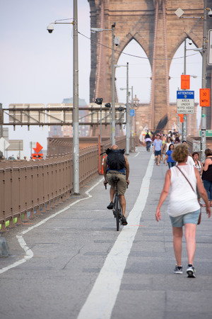 NEW YORK - USA - JUNE,12 2015 people crossing manhattan bridge at sunsetのeditorial素材