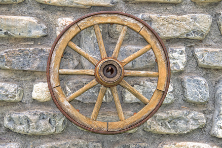 Far west wagon wheel isolated on wallの写真素材