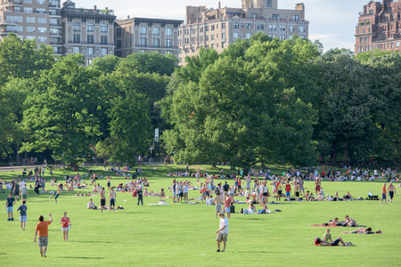 NEW YORK - USA - 14 JUNE 2015 people is spending time amusing in central park on sunny sunday