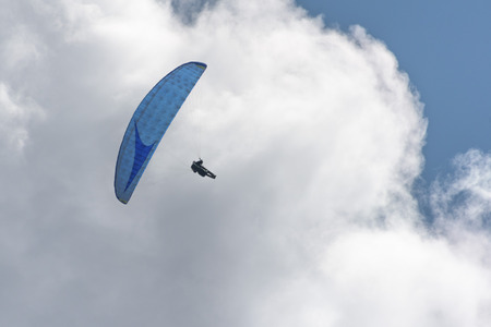 hang glider on the sky backgroundの写真素材