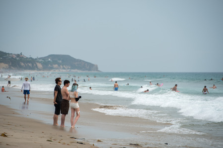 LOS ANGELES, USA - AUGUST 3, 2014 - people on Zuma sandy  beach in summer timeのeditorial素材