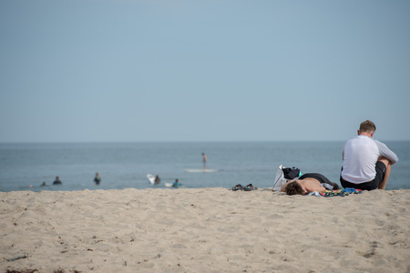 LOS ANGELES, USA - AUGUST 5, 2014 - people in venice beach landscape and baywatch tower in los angelesのeditorial素材