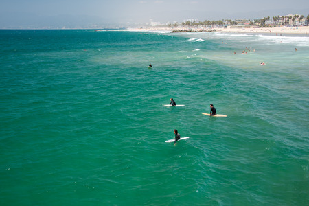 LOS ANGELES, USA - AUGUST 5, 2014 - people in venice beach landscape and baywatch tower in los angelesのeditorial素材