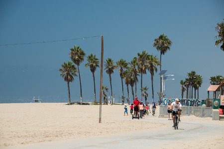 LOS ANGELES, USA - AUGUST 5, 2014 - people in venice beach landscape and baywatch tower in los angelesのeditorial素材