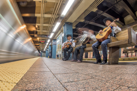 NEW YORK - USA - 13 JUNE 2015 - Mexican guitars players in metro station
