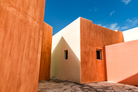 mexican house roof and wall detail on blue sky backgroundの写真素材