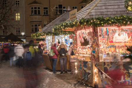 TRENTO, ITALY - DECEMBER 1, 2015 - People buying at the shops of traditional christmas marketのeditorial素材