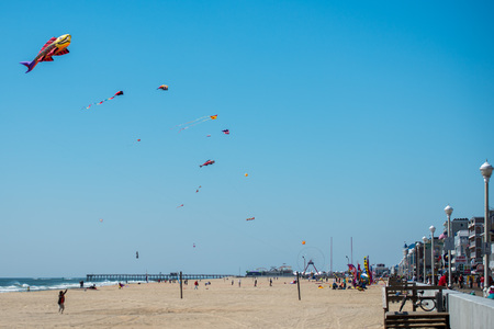 OCEAN CITY, USA - APRIL 24, 2014 - People walking the boardwalk and having fun in Maryland  famous ocean cityのeditorial素材