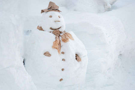 Real big fat snowman on white snow in winter time