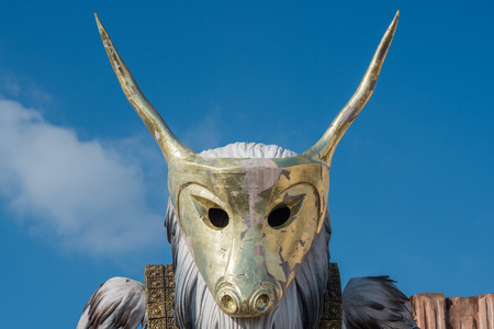 VIAREGGIO, ITALY - FEBRUARY 17, 2013 - Carnival Show parade on town street with traditional Burlamacco Pulcinella style mask and wagon papier mache stone faced paradeのeditorial素材
