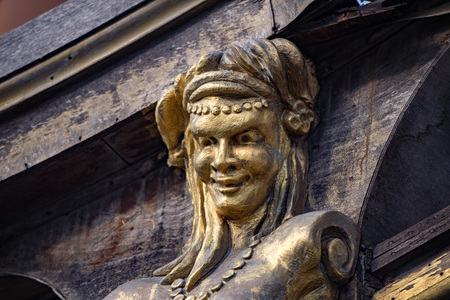 gold statues on pirate sail ship detailの写真素材