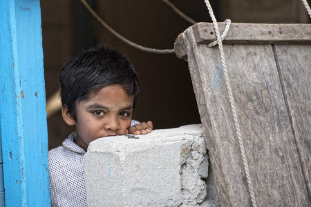 KONDEY, MALDIVES - MARCH, 12 2014 - Childrens are playing in the street before evening pray time in suvadiva island small villageのeditorial素材