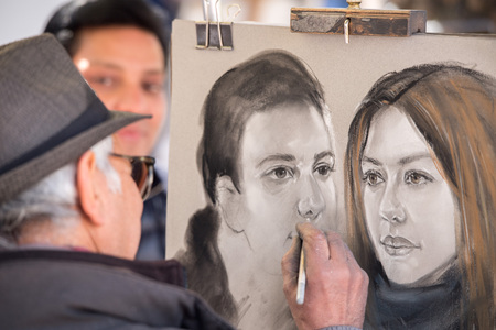 PARIS, FRANCE - MAY 1 2016 - Artist painting and drawing portraits on sunny sunday day in Montmartre Place du Tertre famous artist retreatのeditorial素材